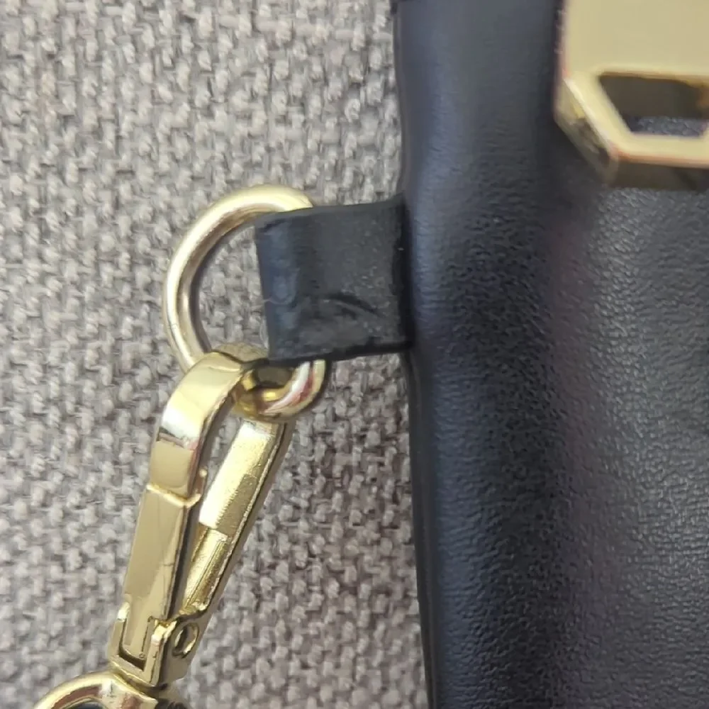 BCBGMaxAzria Black and Gold Wristlet Clutch